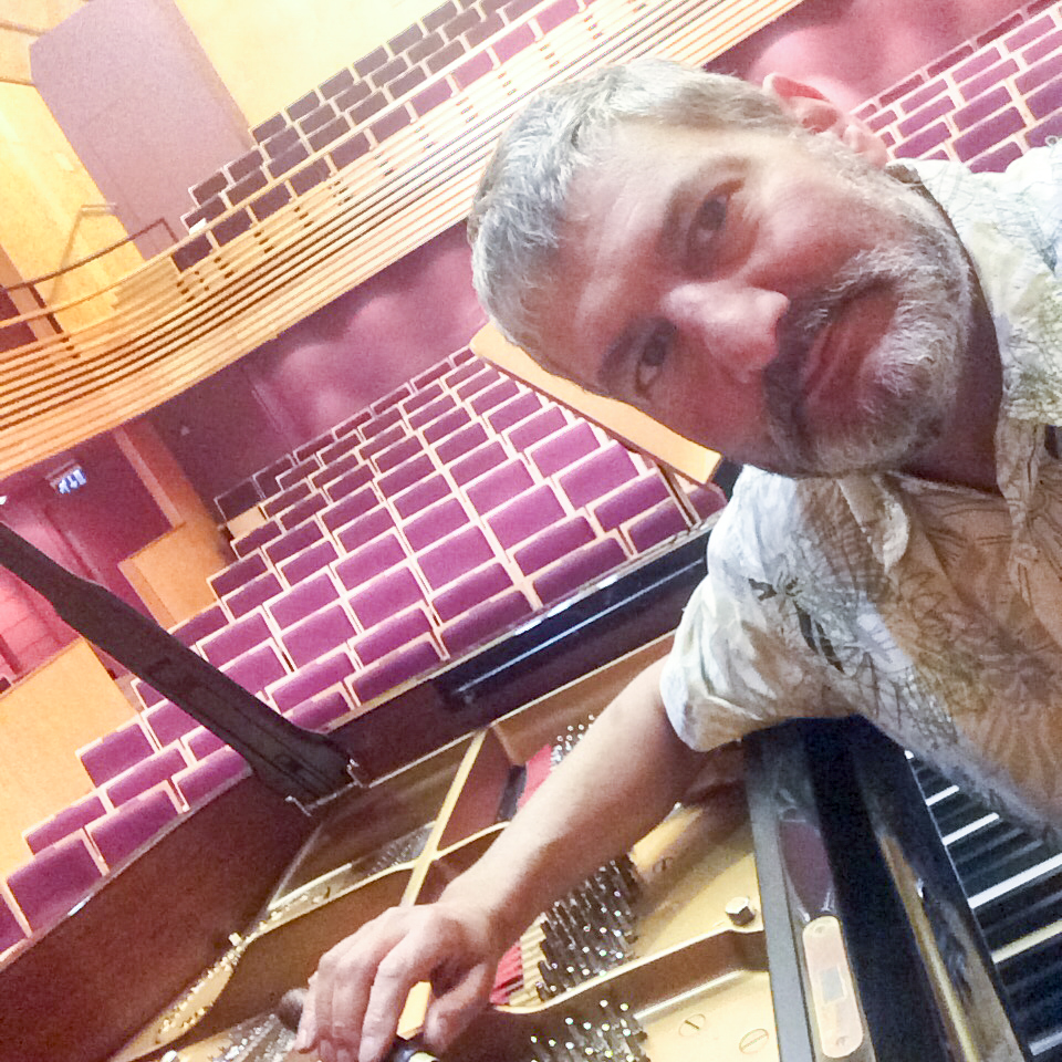 Tim Hendy tuning a Steinway concert grand at The Menuhin Hall