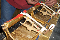 Tim Hendy Pianos workshop, new Steinway action rail wedged temporarily in place